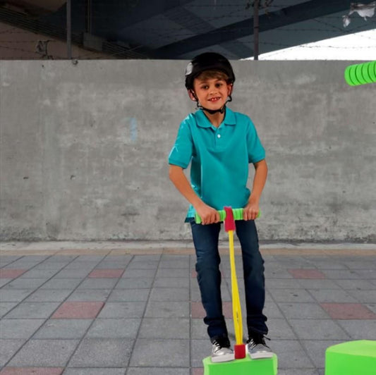 A kid playing on a pogo stick